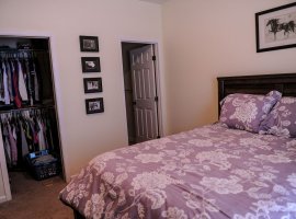 Bedroom with closet and bathroom